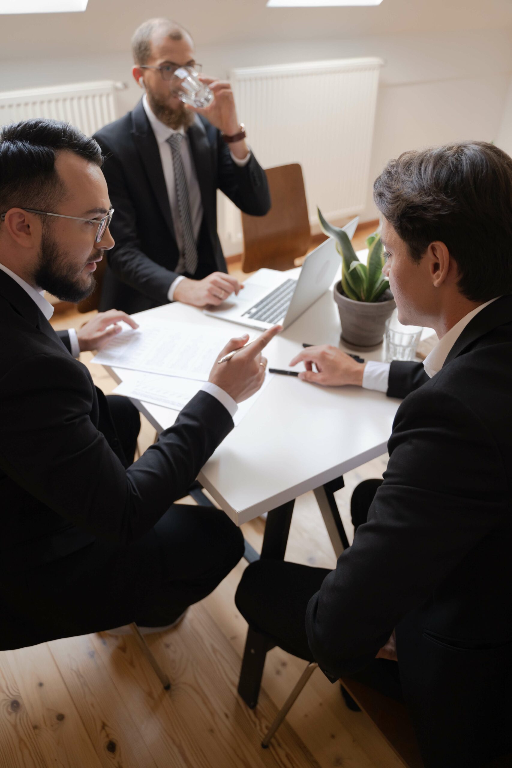 people around a table talking in a business setting